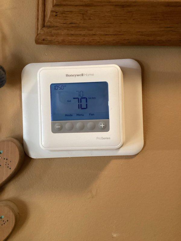 Responded to no-heat call for a 13-year-old Goodman furnace system. Upon arrival, customer reported intermittent operation with heat working overnight but failing during inspection. Diagnosed thermostat communication issues after multiple power cycling attempts and battery verification. Installed new Honeywell T4 ProSeries thermostat to resolve the intermittent control problem and verified proper system operation before departure.