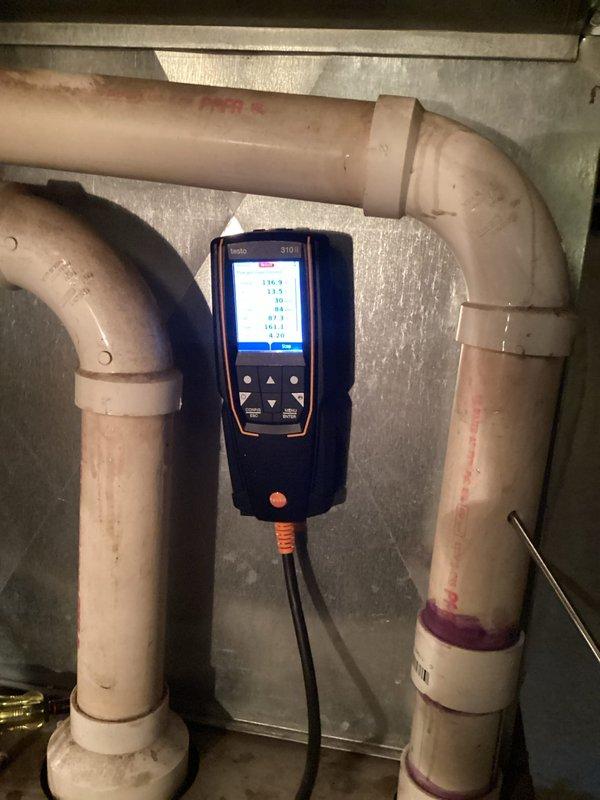 Responded to customer complaint of furnace cycling issues. Performed diagnostic testing on LP furnace (2000 model) and monitored operation through complete heat cycle. Identified condensate drainage problem with current setup requiring manual emptying of collection bucket; documented system condition with photographs for future replacement estimate consideration.