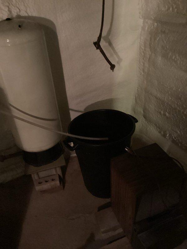 Responded to customer complaint of furnace cycling issues. Performed diagnostic testing on LP furnace (2000 model) and monitored operation through complete heat cycle. Identified condensate drainage problem with current setup requiring manual emptying of collection bucket; documented system condition with photographs for future replacement estimate consideration.