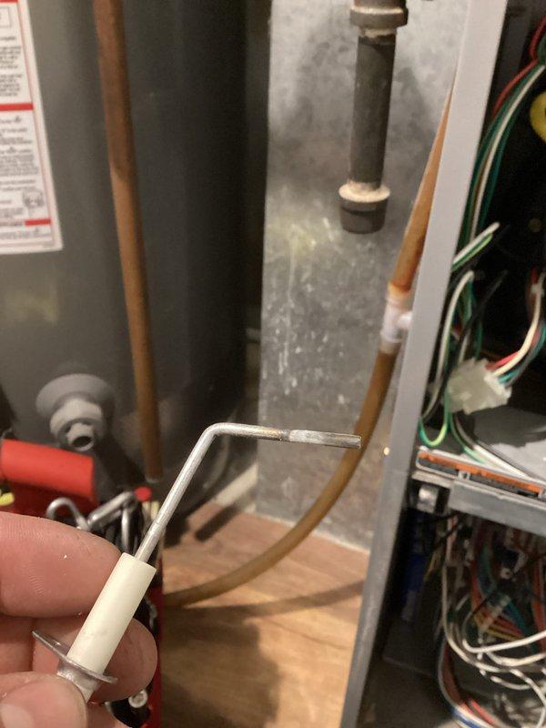 Responded to a no-heat call for aging furnace exhibiting pressure switch error code. Diagnostic testing with Fluke 902FC meter revealed 47.3 ohms resistance. Found exhaust flue blocked with ice accumulation, cleared the obstruction, and removed water from pressure switch and condensate trap. System successfully restored to normal operation; recommended replacement of dual pressure switch due to water intrusion.