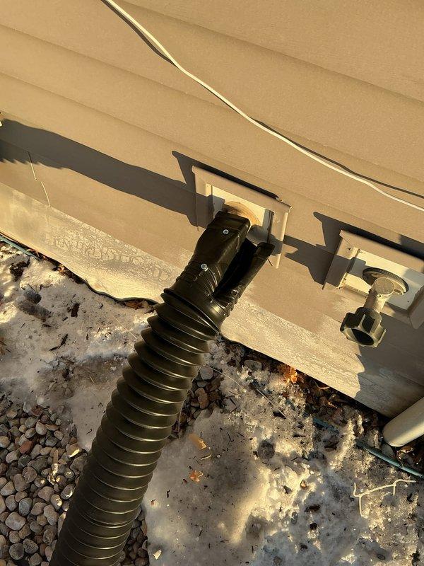 Responded to service call for frozen sump pump discharge line with seal rupture. Inspected system to identify water source issues, drained the pump basket to restore functionality, and examined the discharge pipe connection which showed signs of wear. Recommended insulation for the exterior discharge line to prevent future freezing.