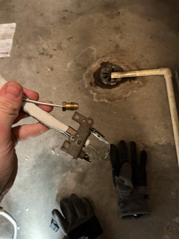 Diagnosed non-functional Richmond water heater (NG, power vent, 7-10 years old) with broken pilot light and thermal pile assembly. Removed damaged assembly components and placed order for replacement parts. Provided customer with estimate for new assembly installation.