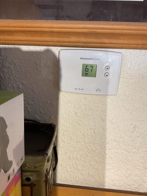 Responded to callback service for no heat issue after recent repair. Upon arrival, found blower running but heating system not firing. Diagnosed loose connection at hot surface ignitor (HSI), disconnected and reconnected the HSI plug which restored proper system operation. Verified repair by testing system startup multiple times with consistent ignition confirmed. System now heating properly with thermostat displaying correct operation.