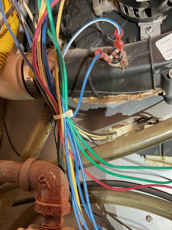 Responded to callback service for no heat issue after recent repair. Upon arrival, found blower running but heating system not firing. Diagnosed loose connection at hot surface ignitor (HSI), disconnected and reconnected the HSI plug which restored proper system operation. Verified repair by testing system startup multiple times with consistent ignition confirmed. System now heating properly with thermostat displaying correct operation.