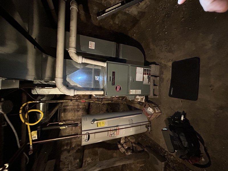 Responded to no heat service call for a residence with dual heating system (geothermal and propane furnace). Upon arrival, found furnace operating but struggling to maintain temperature in poorly insulated home. Diagnosed system was functioning correctly but efficiency was compromised by severely clogged air filter. Replaced air filter and verified normal operation of both heating systems. Determined geothermal unit was running properly but unable to keep up with heating demand in cold conditions, causing automatic switchover to propane furnace as designed.