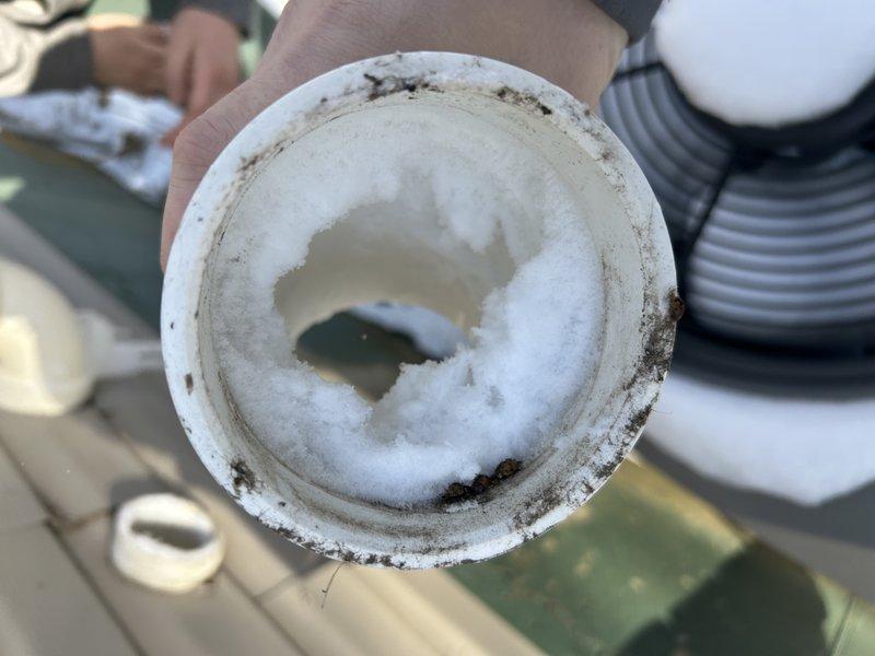 Responded to no-heat call for 15-year-old furnace. Diagnosed seized inducer motor and found broken drain kit leaking water and exhaust fumes into furnace cabinet. Provided customer with repair options for inducer motor, drain kit, and thermostat replacement, along with replacement furnace option for comparison. Customer will review options before deciding on repair versus replacement.