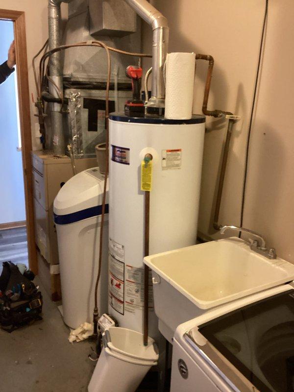 Responded to service call for water heater with no hot water. Diagnosed pilot light failure and identified pinhole leak in tank. Provided customer with replacement options as repair not feasible due to tank integrity compromise.