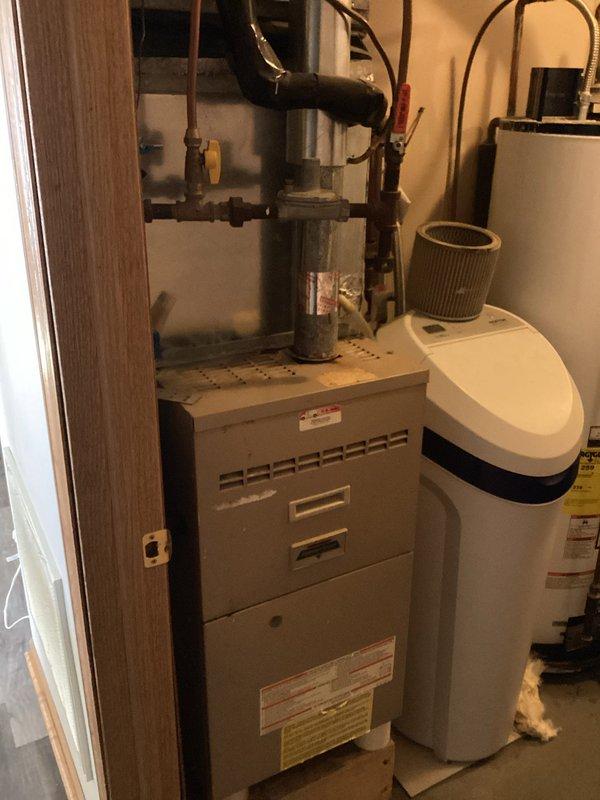 Responded to service call for water heater with no hot water. Diagnosed pilot light failure and identified pinhole leak in tank. Provided customer with replacement options as repair not feasible due to tank integrity compromise.