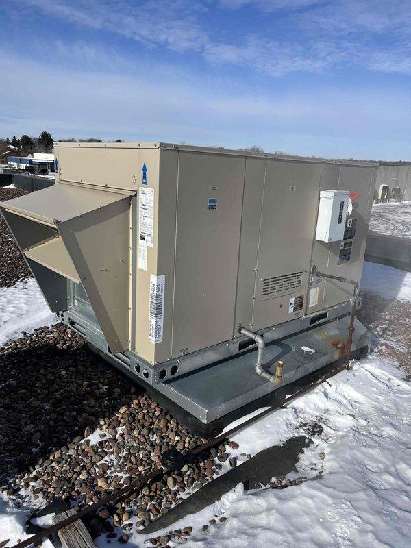 Responded to no heat call for RTU with recent heat exchanger replacement. Investigated unit that had struggled during extreme cold weather. Found minor flame sensor fouling and significant ice buildup on gas line near exhaust, potentially restricting gas flow. System has resumed normal operation following weather improvement. Customer advised to monitor performance and report any recurrence.