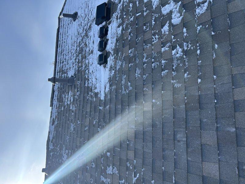 Responded to emergency no-heat call for 2-year-old Lennox furnace. Diagnosed issue as frozen exhaust on roof with cracked concentric vent causing exhaust recirculation through intake. Restored heating by clearing ice blockage from exhaust and temporarily modified system by cutting off intake above furnace to draw air from mechanical room. Furnace now operational; recommended replacement of concentric vent or conversion to two-pipe system.