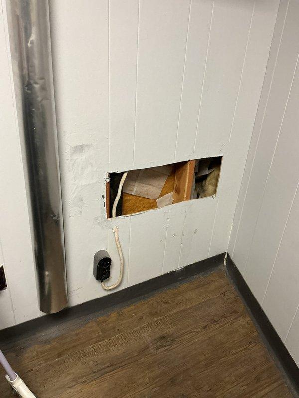 Diagnosed and resolved kitchen sink drainage issue by cutting access hole in wall panel to reach blocked drain pipe at floor level. Cleared obstruction that was causing water to back up into open sewer vent under sink, resulting in leaks when garbage disposal was used. Provided consultation regarding installation of air admittance valve as requested by customer.