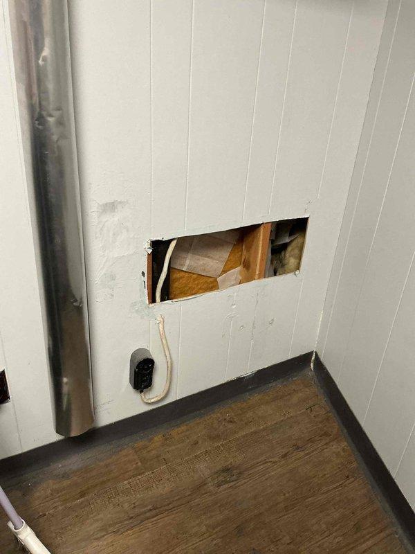 Diagnosed and resolved kitchen sink drainage issue by cutting access hole in wall panel to reach blocked drain pipe at floor level. Cleared obstruction that was causing water to back up into open sewer vent under sink, resulting in leaks when garbage disposal was used. Provided consultation regarding installation of air admittance valve as requested by customer.