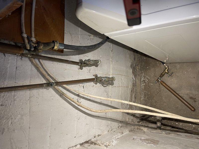 Responded to no heat call at residence with LP furnace. Found unit was switched off; restored power and verified operation, though evidence of limit switch activation observed due to heavily clogged filter. Discovered entire house was frozen including plumbing fixtures; thawed frozen condensate trap to restore proper drainage and temporarily disconnected frozen condensate pump. Advised customer to reconnect pump upon return and noted potential for significant plumbing issues once thawing occurs.