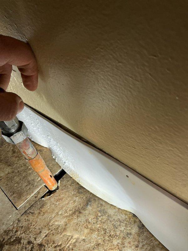 Repaired broken water supply line to toilet. Located leak in crawl space beneath bathroom floor. Cut minimal access hole in floor to reach damaged pipe, then replaced and reconnected the copper supply line with appropriate fittings. Verified proper function and absence of leaks after repair.