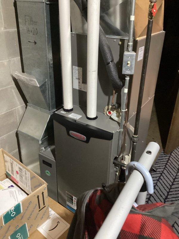 Diagnosed hot water supply issue in four-level residence where upper floor was not receiving hot water. Determined that water heater was functioning properly but system was on load management control that likely deactivated during recent cold weather. Removed load management meter to restore normal hot water delivery to all floors.