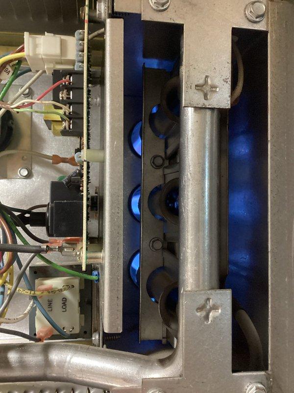 Responded to no-heat call for garage hanging unit. Diagnosed pressure switch fault code. Removed and cleared clogged pressure switch hose of debris, then reinstalled. Unit tested successfully with proper flame sequence observed at burner assembly, restoring normal heating operation.