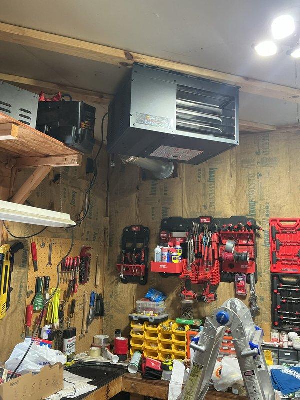 Responded to a customer complaint of gas odor originating from the garage heater. Upon inspection, identified a loose union fitting on the LP gas line serving the ceiling-mounted heating unit. Tightened the union fitting to secure the connection and eliminate the gas leak. Customer was informed of findings and resolution.