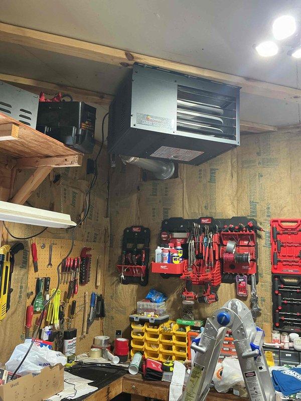 Responded to a customer complaint of gas odor originating from the garage heater. Upon inspection, identified a loose union fitting on the LP gas line serving the ceiling-mounted heating unit. Tightened the union fitting to secure the connection and eliminate the gas leak. Customer was informed of findings and resolution.