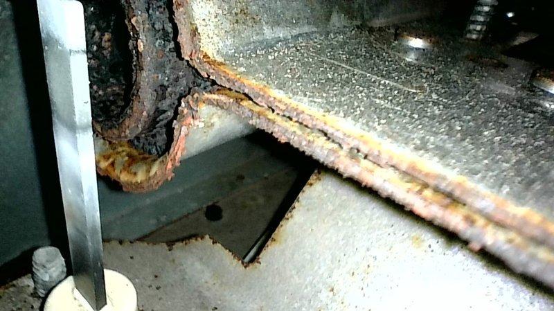 Responded to no heat complaint on aging furnace. Diagnosed water accumulation in pressure switch hose preventing high stage operation. Cleaned components, improved hose slope to ensure proper drainage, and performed comprehensive inspection of heat exchanger and burners. Noted burners showing early signs of contamination and potential need for pressure switch replacement. System now operating correctly with proper combustion and heating capability.