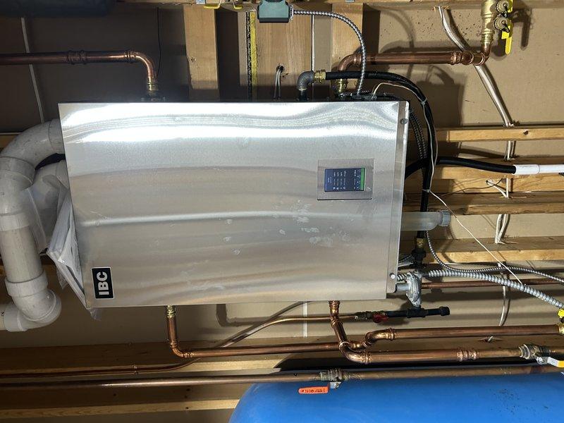 Replaced four Taco thermostats and one Honeywell T4 thermostat throughout the residence as part of a planned system upgrade, as the original units were over 20 years old. Successfully installed new thermostats in the basement (4), garage (1), and main floor (1), then verified proper boiler operation after installation. Customer opted to defer replacement of the master bathroom thermostat for a future service.