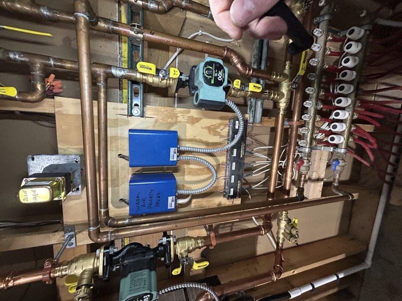 Replaced four Taco thermostats and one Honeywell T4 thermostat throughout the residence as part of a planned system upgrade, as the original units were over 20 years old. Successfully installed new thermostats in the basement (4), garage (1), and main floor (1), then verified proper boiler operation after installation. Customer opted to defer replacement of the master bathroom thermostat for a future service.