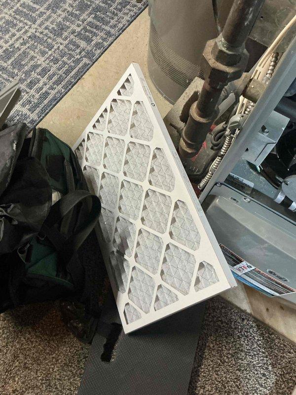 Diagnosed no heat issue on 3-year-old system caused by blocked airflow. Found severely clogged filter and condensation buildup from portable ultrasonic humidifier usage. Replaced filter, cleared blocked outside flue, and recommended installation of whole house humidifier to prevent future issues.