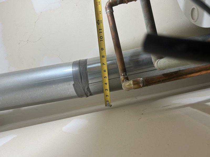 Performed routine 8-9 furnace tune-up on 2-year-old system with Family Rewards plan. Inspected and cleaned standard components, confirming proper operation. Identified issue with fresh air intake vent discharging directly onto mechanical room floor near hot/cold manifold, likely contributing to customer's reported pipe freezing problem. Recommended rerouting fresh air intake to prevent cold air from pooling at floor level and provided option for follow-up service to implement solution.