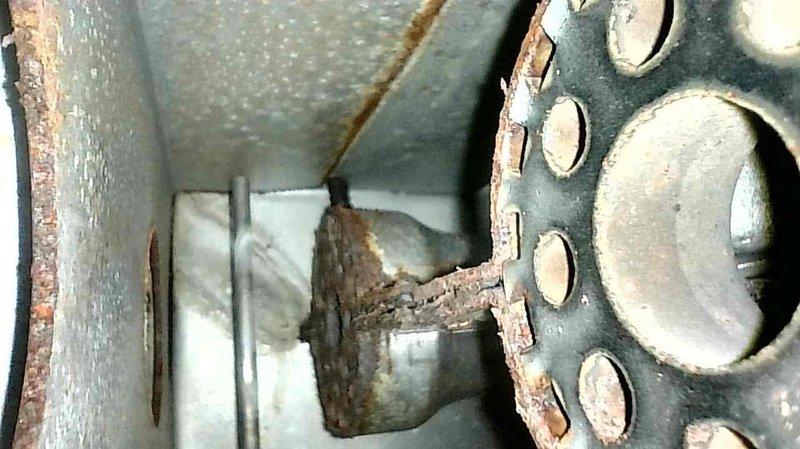 Responded to no-heat complaint on 10+ year old York LP modulating furnace. Detected aldehyde odor indicative of rotted secondary heat exchanger upon arrival. Inspection confirmed secondary heat exchanger failure with visible perforation, excessive black exhaust deposits, and water accumulation around unit. Visual inspection via camera showed customer the deteriorated component. Determined likely cause was previous gas valve malfunction leading to sooting, secondary heat exchanger plugging, and subsequent corrosion. Equipment was shut down and tagged out for safety due to carbon monoxide hazard. Customer declined repairs based on system's ongoing reliability issues.