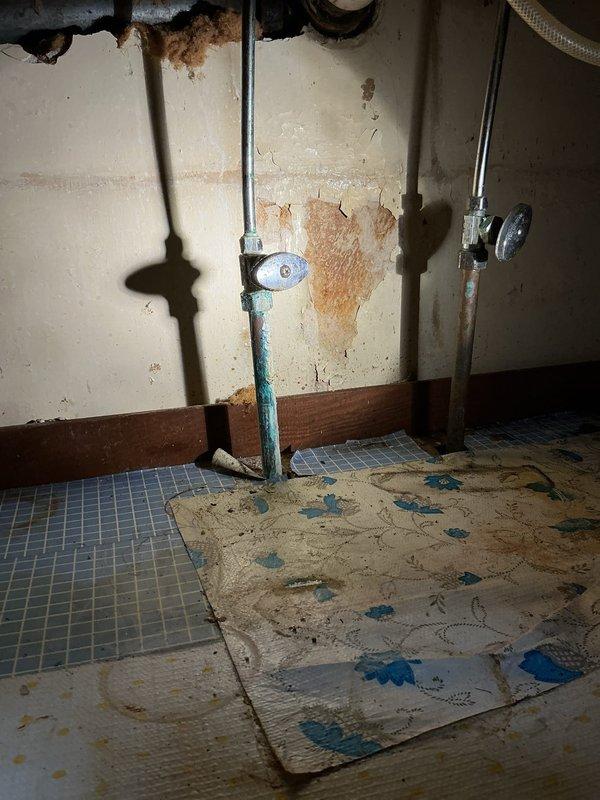 Responded to service call for kitchen sink issues. Discovered galvanized drain pipe had rotted through wall, causing leakage. Replaced deteriorated drain assembly and one faulty supply shut-off valve to restore proper functionality. Documented extensive water damage to surrounding wall area requiring future attention.