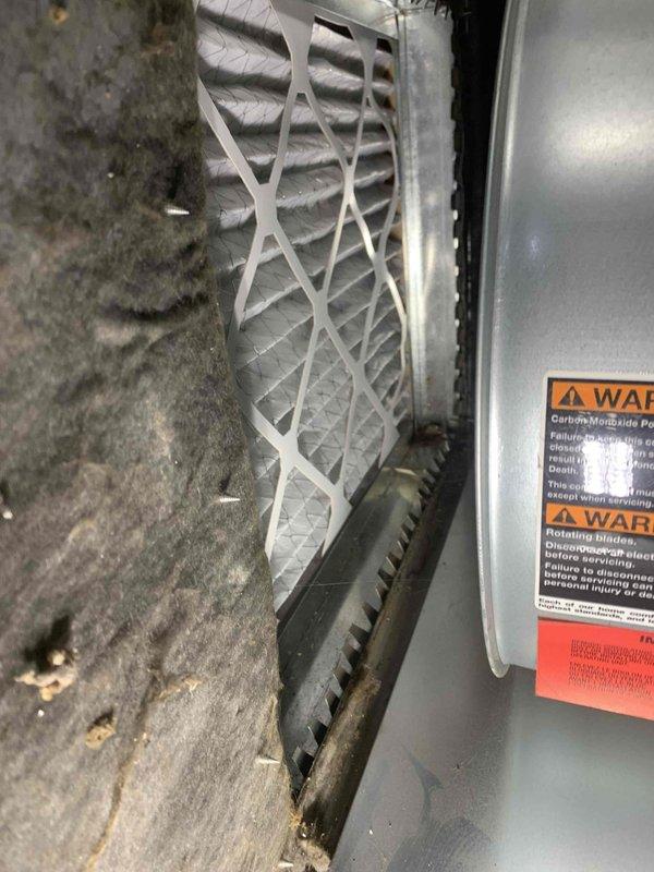 Responded to service call for furnace noise complaint described as "like a train." Discovered loose supply register damper in bedroom which was causing the noise; secured damper in open position. Demonstrated proper air filter replacement technique to homeowner to address difficulties with filter removal. Inspected all other registers and verified system is operating normally.
