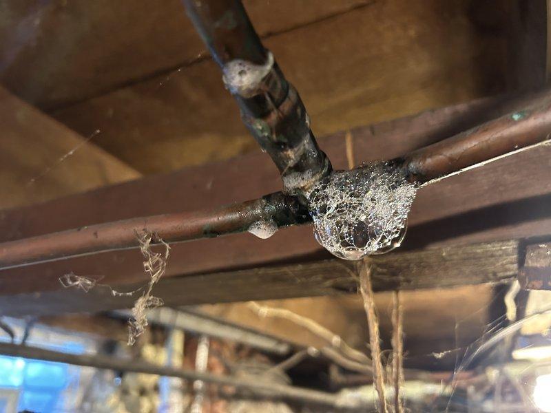 Added 10 gallons of ProTek glycol freeze protector to the boiler system, achieving 30% concentration as specified in the estimate. Identified and repaired a gas leak at an old tee connection to the water heater by cutting out the deteriorated section and installing a coupling. Performed operational testing to verify proper circulation and heating function of the boiler system with all components now working correctly.