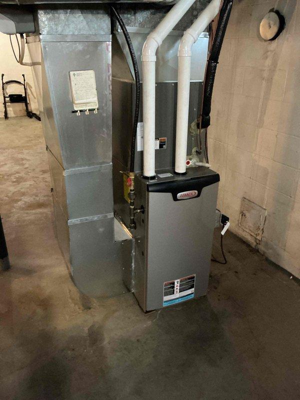 Identified and repaired a leak at the adapter connecting the water softener to the drain line. Inspection revealed the issue stemmed from the installation configuration where both water treatment tanks were connected to a single drain line using the original softener drain pipe. Properly secured connections to eliminate the intermittent leak that had persisted despite previous repair attempts.