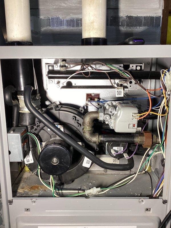 Diagnosed and resolved no-heat issue on 6-year-old gas furnace. Found open high limit switch due to severely clogged air filter, which was restricting proper airflow. Replaced air filter and performed comprehensive system check including ignitor, flame sensor, inducer, condensate drain, pressure switch, heat exchanger and burners. System restored to normal operation and now heating properly to thermostat setpoint.