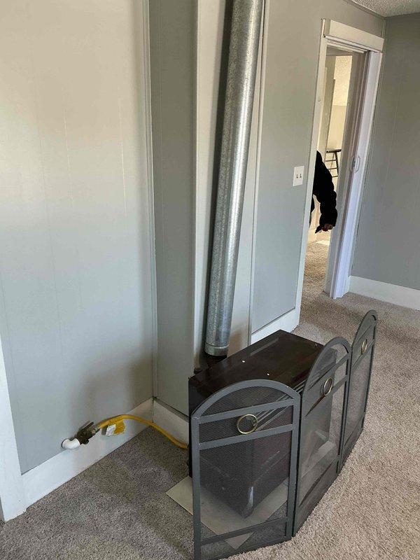 Responded to no-heat service call at upstairs apartment. Upon inspection, discovered unit is actually a gas fireplace with no ducted HVAC system present. Confirmed proper operation of existing fireplace. Recommended installation of appropriate heating system; customer referred to comfort advisor for furnace or heat pump options.