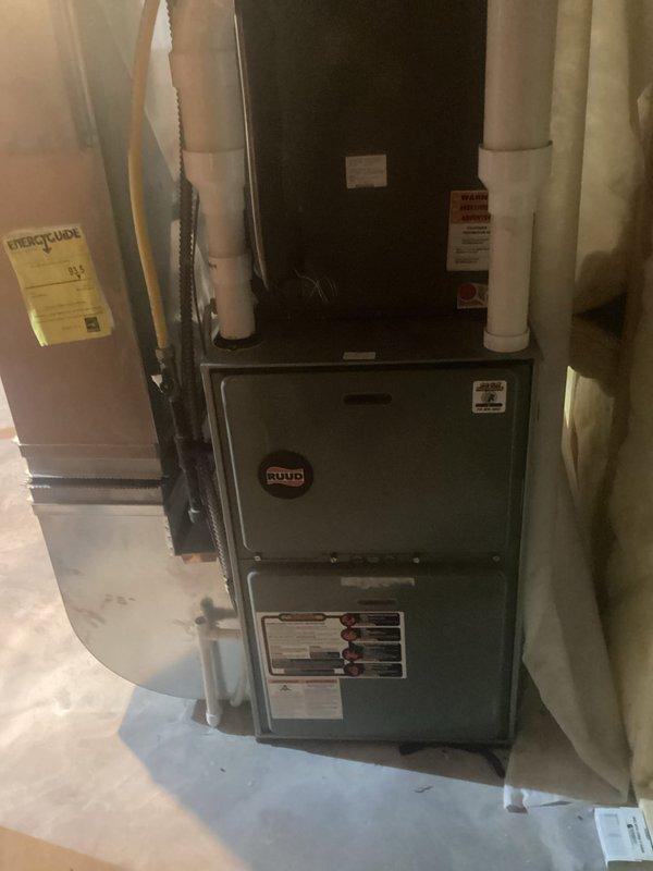 Diagnosed and resolved issue with 2013 Ruud furnace running continuously and failing to maintain temperature. Identified overheating condition with furnace cycling on limit switch due to severely restricted airflow from dirty filter, compounded by wood fireplace usage. Removed clogged filter which restored proper operation. Installed customer-requested T10 Pro smart thermostat with remote control capability. Tested complete system operation and verified proper functionality. Advised customer about heat exchanger condition and overall furnace age.