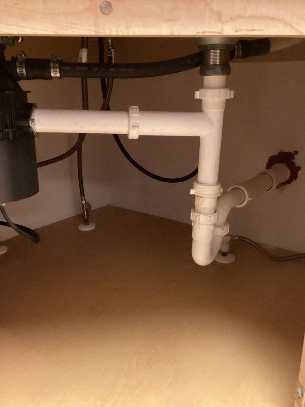 Cleared clogged kitchen sink drain by snaking the line 25ft. Inspected P-trap and drain assembly for proper installation and verified proper water flow after service. Sink now drains normally with no backup issues.