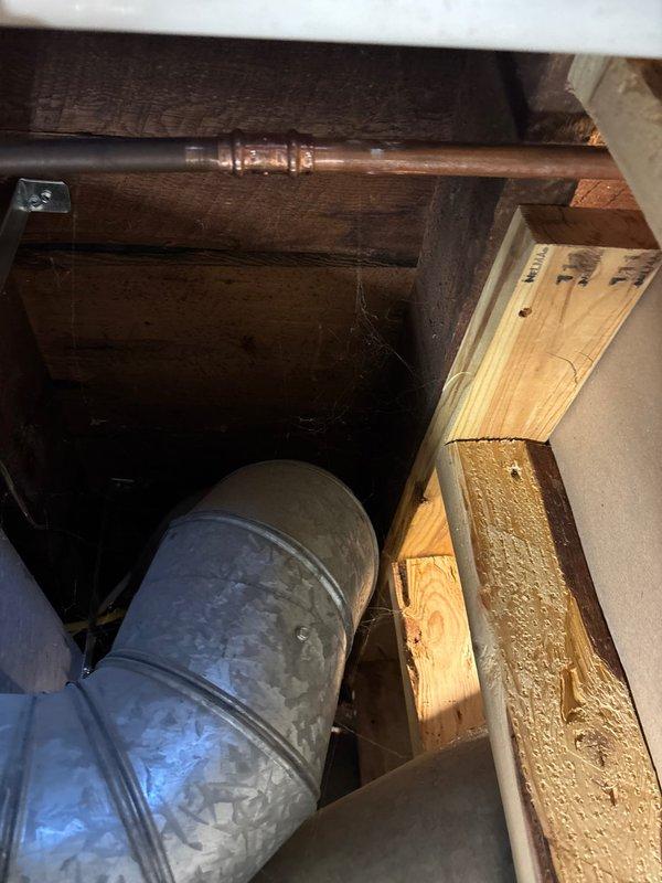 Repaired a small corrosion leak at a 1/2" copper 90-degree elbow joint located in the basement. Removed damaged section of pipe and replaced with new copper pipe, one 90-degree elbow fitting, and two couplings. Confirmed proper soldering at all connection points and verified system integrity with no further leaks observed.