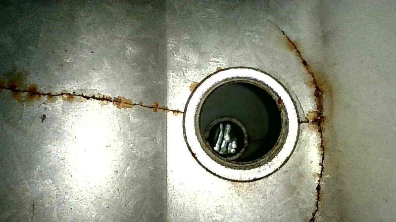 Responded to no heat complaint on unit less than 10 years old. Replaced blower motor and pressure switch after observing severely clogged blower wheel. Inspection of heat exchanger revealed significant cracking with visible rust streaks and deterioration, as documented in photographs. Homeowner advised of heat exchanger failure and has requested quotation for complete furnace replacement.