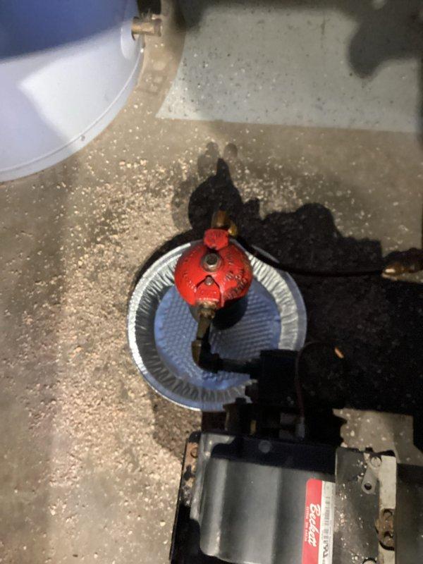 Responded to service call for oil furnace leaking around filter area. Diagnosed issue as insufficiently tightened bleed screw from previous service. Tightened bleed screw properly and cleaned up oil spillage from floor to resolve the leak.