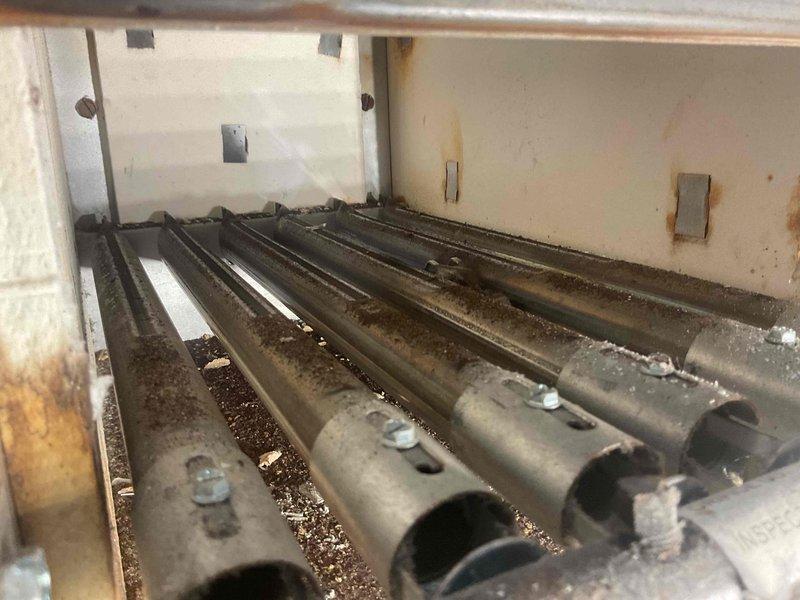 Responded to no heat call for natural gas furnace of indeterminate age. Inspection revealed broken ignition box and heat exchanger seal, creating potential for dangerous gas leakage. Additionally, observed significant corrosion throughout system, debris accumulation on burner tubes, and faulty transformer sending only 14V (insufficient for proper operation). Due to multiple critical safety issues and extensive deterioration, complete system replacement was performed rather than attempting repairs on the severely compromised unit.