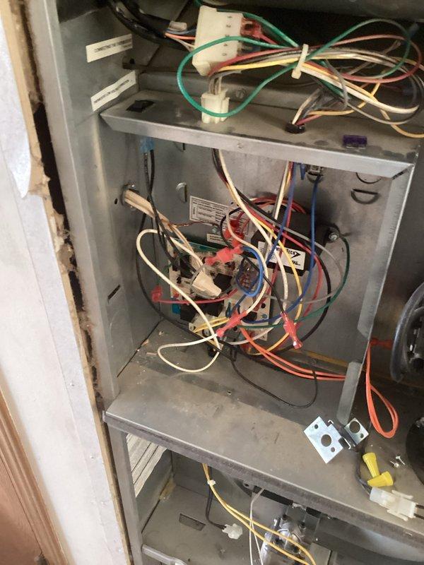 Diagnosed no-heat issue on aging furnace and found failed ignitor. After installing universal replacement ignitor, determined control board was also faulty. Successfully restored heating operation by replacing both the ignition control board and ignitor.