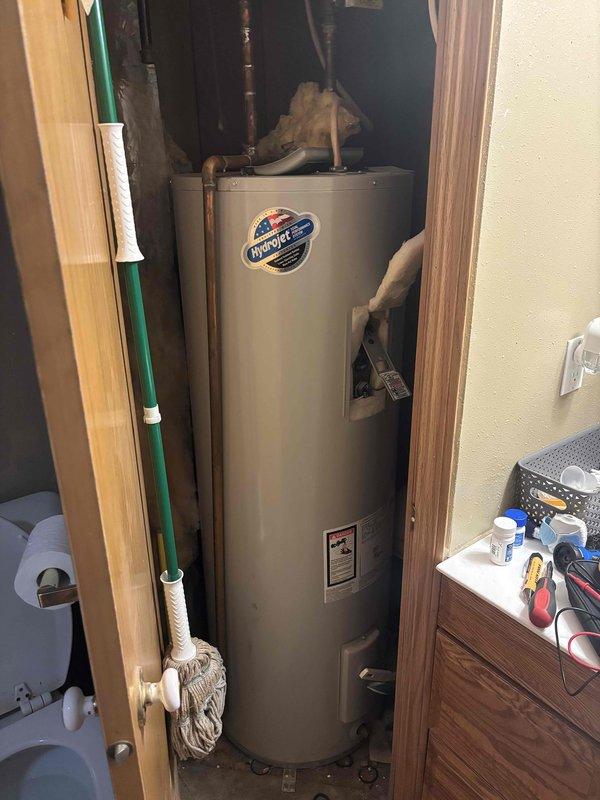 Diagnosed and serviced 50-gallon Bradford White electric water heater with insufficient heating due to failed elements and significant sediment accumulation. Replaced both upper and lower heating elements and thermostats, then performed complete system drain down and flush to remove sediment buildup, restoring proper functionality to the 10-year-old unit.