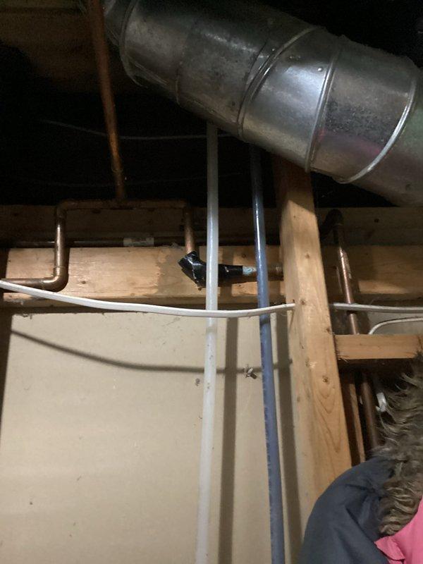 Responded to a water leak service call where customer reported previous service history. Upon inspection, determined primary issue was not the water line leak above laundry tub but rather a clogged main drain causing water to back up through floor drain in mechanical room when basement bathroom fixtures were used. Confirmed previous service in 2023 that included camera inspection and drain snaking. Recommended customer contact specialized drain service (Clog Un-boggler) to clear main drain line to city interceptor and provided estimate for separate water line repair.