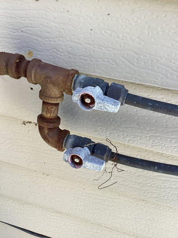 Replaced malfunctioning gas pressure regulator on exterior gas line serving home's fireplaces. Removed corroded T-fitting and installed new regulator with appropriate connections and valves to ensure proper gas pressure to system. Completed all necessary testing to verify safe operation.
