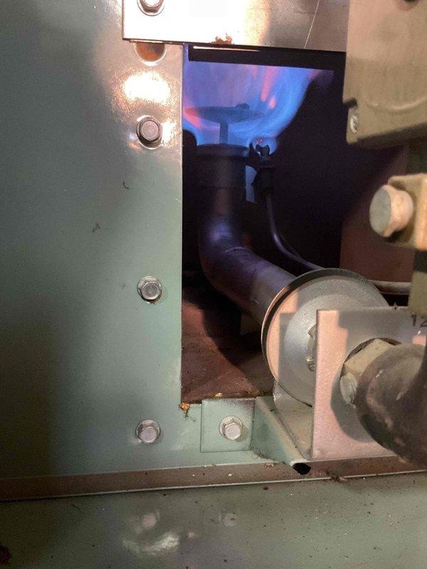 Responded to service call for pilot light repeatedly extinguishing in aging furnace. Upon inspection, discovered significant heat exchanger deterioration with visible cracking and corrosion, along with a failing blower motor with loose belt. Recommended full system replacement as repair costs would approach replacement value. Set up emergency replacement service due to safety concerns.