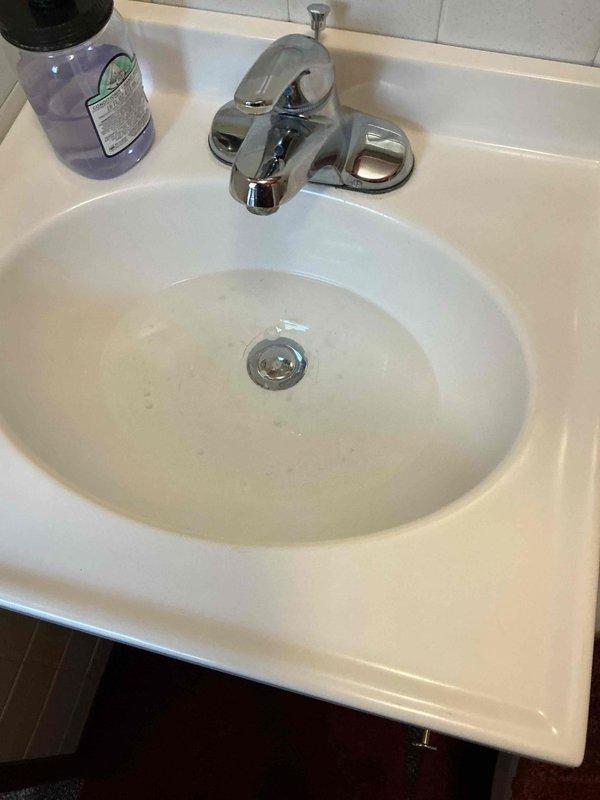 Responded to warranty service call for previously installed drain assembly kit. Diagnosed issue where rubber o-ring had detached from sink drain. Replaced defective o-ring and verified proper drain function.