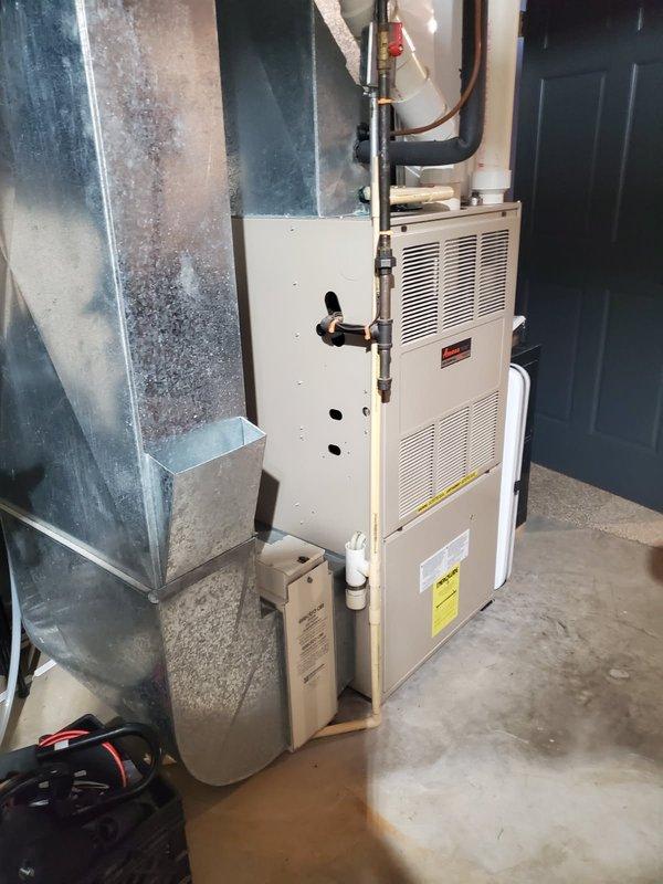 Responded to no heat call for Amana LP furnace. Diagnosed completely plugged furnace filter caused by ultrasonic humidifiers as source of issue. Reset limit switch after filter replacement, restoring normal operation. Performed visual inspection of heat exchanger and burners, confirmed system is in good working condition for its age. Advised customer about proper humidification options.