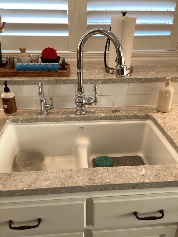 Responded to service call for a leaking Kohler kitchen faucet. Customer provided replacement cartridge which was successfully installed, resolving the water leak issue under the sink. Verified proper operation after installation with no further leaks observed.