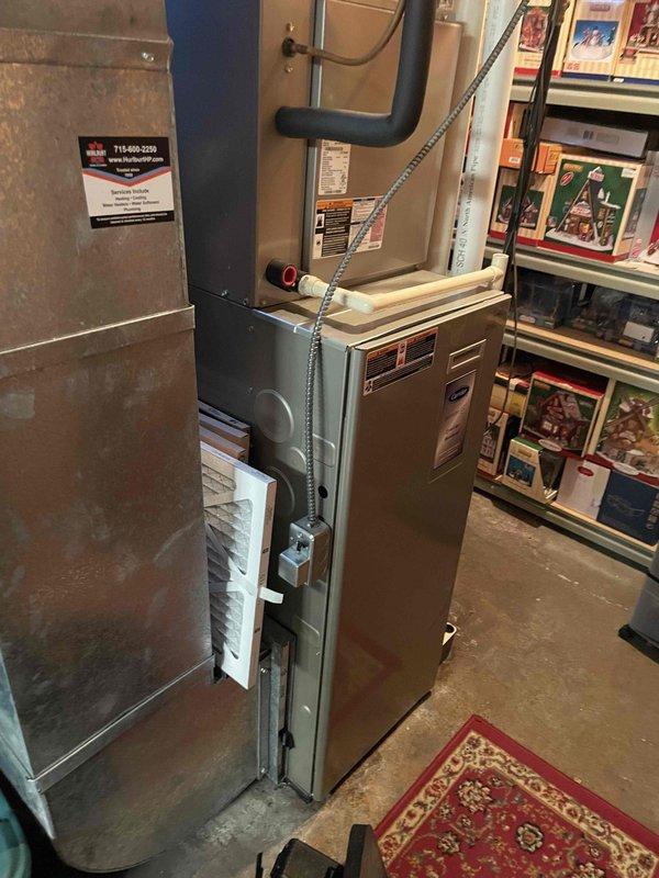 Responded to service call for 15-year-old furnace with reported thermostat malfunction error. Customer had previously reset power to restore operation after furnace quit during cold weather. Inspection revealed no abnormal system operation, though ice buildup around exterior exhaust vent was noted as potential cause of previous malfunction. System operated properly throughout diagnostic testing. Furnace appears to be functioning normally following comprehensive inspection.