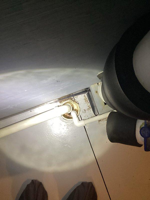 Responded to service call for sewer flies emerging from an open-site line connecting boiler to floor drain. Inspection revealed pipe was heavily contaminated with bacteria creating a breeding environment. Performed thorough line flushing using full pressure water and air snake to dislodge and remove accumulated biological matter. Attempted to use cable snake for additional cleaning but discovered equipment was non-functional.